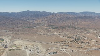 CAP_006_010 - HD stock footage aerial video of neighborhoods near the California Aqueduct and mountains in Palmdale, California