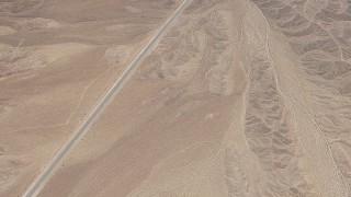 CAP_006_012 - HD stock footage aerial video of bird's eye view of a highway through open desert in San Bernardino County, California