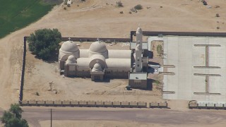CAP_006_024 - HD stock footage aerial video of a Mojave Desert monastery in Newberry Springs, California