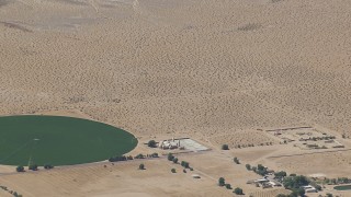CAP_006_026 - HD stock footage aerial video zoom to a wiper view of a Mojave Desert monastery and crop circle in Newberry Springs, California