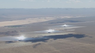 CAP_006_034 - HD stock footage aerial video of cloud shadows on the Ivanpah Solar Electric Generating System in California