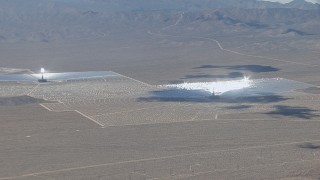 CAP_006_043 - HD stock footage aerial video zoom wider from one of the three solar arrays at Ivanpah Solar Electric Generating System in California