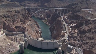 CAP_008_002 - HD stock footage aerial video orbit Hoover Dam and the bypass bridge, Nevada