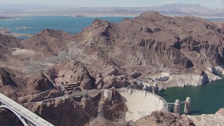 CAP_008_003 - HD stock footage aerial video orbit Hoover Dam, with Lake Mead visible in the background, Nevada