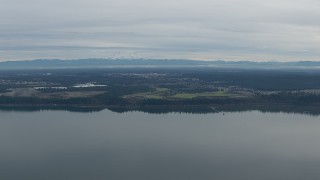 CAP_009_001 - HD stock footage aerial video of Mount Rainier and golf course seen from Puget Sound in DuPont, Washington