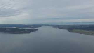CAP_009_008 - HD stock footage aerial video fly over Puget Sound to approach the Tacoma Narrows Bridge, Washington