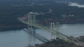 CAP_009_013 - HD stock footage aerial video zoom wider while passing the Tacoma Narrows Bridge spanning Puget Sound, Washington