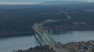 CAP_009_014 - HD stock footage aerial video tilt from the Tacoma Narrows Bridge to reveal the Olympic Mountains, Washington