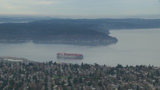 CAP_009_016 - HD stock footage aerial video of a cargo ship sailing Puget Sound by Tacoma, Washington