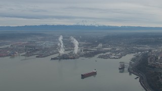 CAP_009_018 - HD stock footage aerial video of Mount Rainier and the Port of Tacoma seen from Commencement Bay, Washington