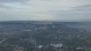 CAP_009_029 - HD stock footage aerial video of Seattle Tacoma Airport and the Downtown Seattle skyline seen from I-5 and suburban neighborhoods, Washington