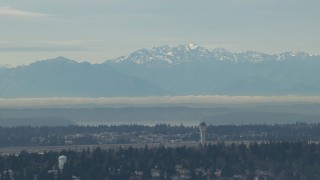 CAP_009_035 - HD stock footage aerial video of the Olympic Mountains and the Seattle Tacoma Airport control tower, Washington