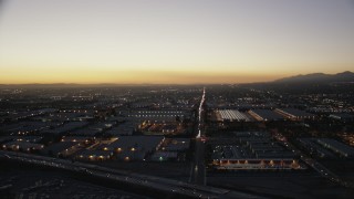 CAP_010_001 - HD stock footage aerial video flyby warehouse buildings at twilight in the San Gabriel Valley, California