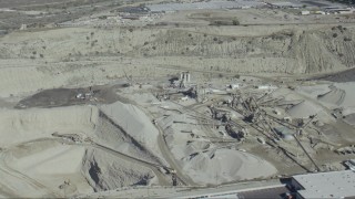 CAP_012_019 - HD stock footage aerial video flyby a working quarry in Asuza, California