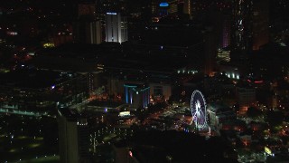 CAP_013_027 - HD stock footage aerial video of orbiting city buildings and Ferris wheel at night, Downtown Atlanta, Georgia