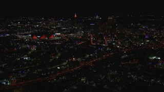 CAP_013_047 - HD stock footage aerial video of a wide view of the stadium and downtown skyline at nighttime, Downtown Atlanta, Georgia