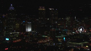 CAP_013_114 - HD stock footage aerial video of slowly flying away from the city's downtown skyline at night, Downtown Atlanta, Georgia