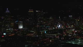 CAP_013_115 - HD stock footage aerial video of a reverse view of the city's downtown skyline at night, Downtown Atlanta, Georgia
