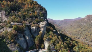 CAP_014_003 - 2.7K stock footage aerial video of orbiting the rock formation at Chimney Rock in North Carolina