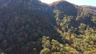 CAP_014_006 - 2.7K stock footage aerial video of ascend and focus on a waterfall at Chimney Rock, North Carolina