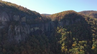 CAP_014_008 - 2.7K stock footage aerial video of flying away from a waterfall at Chimney Rock, North Carolina
