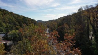 CAP_014_025 - 2.7K stock footage aerial video fly over river and reveal a bridge, Chimney Rock, North Carolina