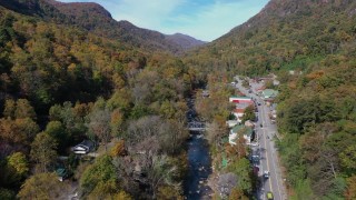 CAP_014_034 - 2.7K stock footage aerial video of a river and a road in a small town, Chimney Rock, North Carolina