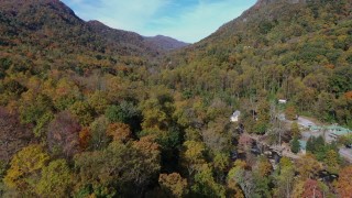 CAP_014_036 - 2.7K stock footage aerial video forest and mountains seen from small town, Chimney Rock, North Carolina