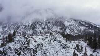 CAP_015_025 - 4K stock footage aerial video of a snowy mountain in the Sierra Nevadas, Inyo National Forest, California
