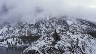 CAP_015_026 - 4K stock footage aerial video of flying by a snowy mountain in the Sierra Nevadas, Inyo National Forest, California