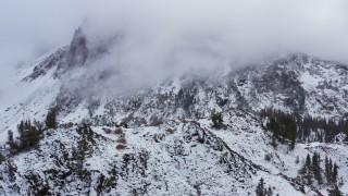 CAP_015_027 - 4K stock footage aerial video of passing by a snowy mountain in the Sierra Nevadas, Inyo National Forest, California
