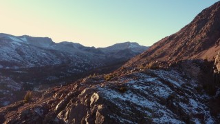 CAP_015_035 - 4K stock footage aerial video reverse view of a mountain valley at sunset, Inyo National Forest, California