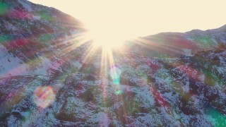 CAP_015_036 - 4K stock footage aerial video descend by snowy mountain at sunset, Inyo National Forest, California