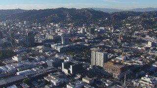 CAP_016_009 - HD stock footage aerial video orbit apartment and college with view of office buildings in Hollywood, California