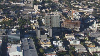 CAP_016_012 - HD stock footage aerial video tilt to and approach college and apartment building in Hollywood, California