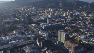 CAP_016_015 - HD stock footage aerial video of flying away from the college and panning across office buildings in Hollywood, California