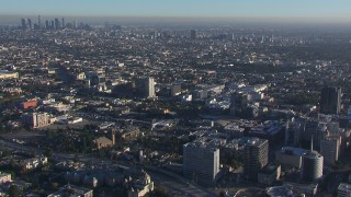 CAP_016_020 - HD stock footage aerial video orbit office buildings, approach apartment and college buildings, Hollywood, California