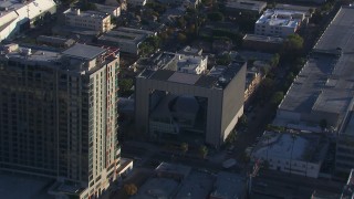 CAP_016_022 - HD stock footage aerial video approach to college beside apartment complex, Hollywood, California