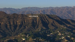 CAP_016_030 - HD stock footage aerial video of flying by the Hollywood Sign in Los Angeles, California