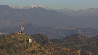 CAP_016_035 - HD stock footage aerial video orbit the iconic Hollywood Sign with view of mountains in Los Angeles, California