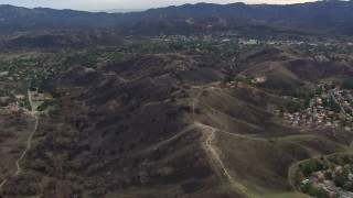 CAP_018_002 - HD stock footage aerial video of flying over burned hills in Malibu, California