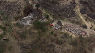 CAP_018_005 - HD stock footage aerial video of a bird's eye view of homes destroyed by fire, Malibu, California