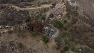 CAP_018_006 - HD stock footage aerial video of orbiting homes destroyed by fire, Malibu, California