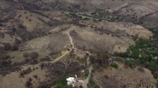 CAP_018_007 - HD stock footage aerial video of flying away from homes and hills destroyed by fire, Malibu, California