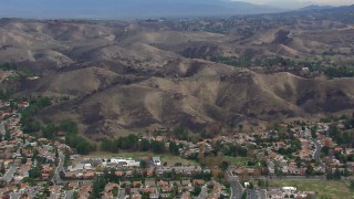 CAP_018_008 - HD stock footage aerial video of orbiting hills scarred by fire, Malibu, California