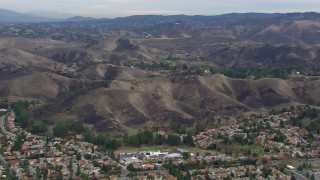 CAP_018_009 - HD stock footage aerial video of an orbit of hills scarred by fire, Malibu, California