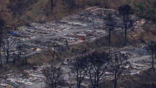 CAP_018_035 - HD stock footage aerial video of a reverse view of a neighborhood devastated by fire, Malibu, California