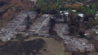 CAP_018_036 - HD stock footage aerial video of flying away from a neighborhood devastated by fire, Malibu, California