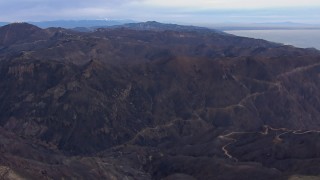 CAP_018_038 - HD stock footage aerial video of flying by mountains devastated by fire, Malibu, California