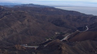 CAP_018_041 - HD stock footage aerial video of mountains scorched by fire, Malibu, California